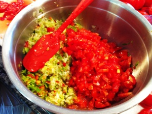 Combine the chopped tomato wth the processed peppers and onions